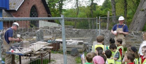 Andrew and George demonstrate the skilled art of the stone mason at the East Church, Cromarty